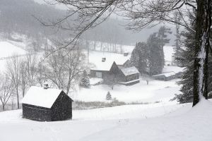 Three Barns in Flying Snow